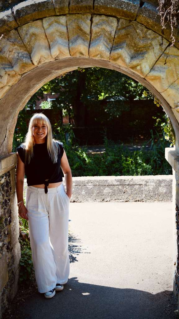Becky Stone, eating disorder therapist, working on her laptop while writing about the cost of putting yourself out there on social media as a therapist